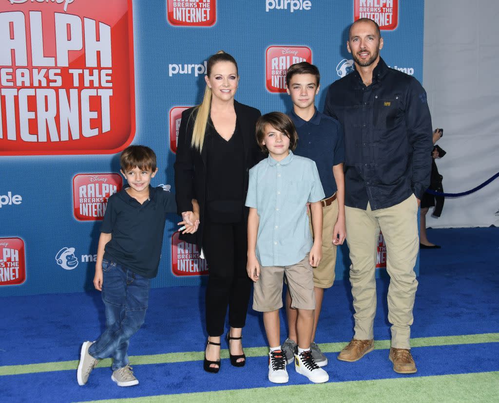 Melissa Joan Hart and husband Mark Wilkerson bring their sons to the premiere of Disney's 