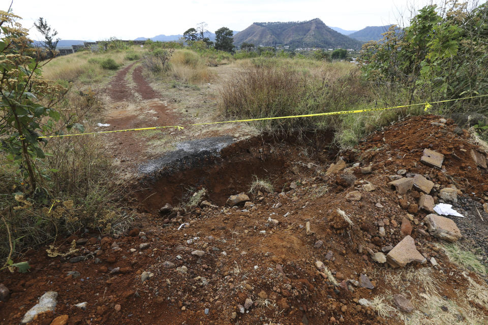 This Feb. 6, 2020 photo shows an pit where 11 bodies were found on Feb. 1, in Uruapan, Michoacan state, Mexico. Uruapan, a city of about 340,000 people, is in Mexico's avocado belt, where violence has reached shocking proportions. (AP Photo/Marco Ugarte)