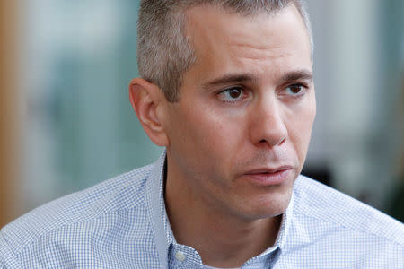 Democratic New York State Assembly member and congressional candidate Anthony Brindisi sits while being interviewed by Reuters after hosting a town hall style meeting at Colgate University in Hamilton, New York, U.S., April 8, 2018. REUTERS/Andrew Kelly