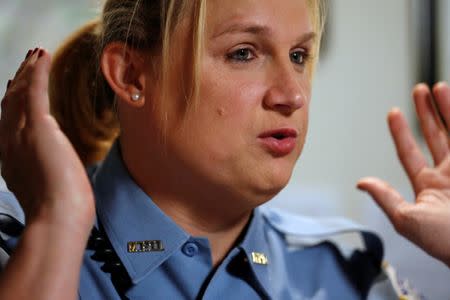Washington Metropolitan Police Department Sergeant Jessica Hawkins, a transgender woman who leads the department's lesbian, gay, bisexual and transgender (LGBT) unit, speaks about her work at her office in Washington, U.S. October 10, 2016. REUTERS/Jonathan Ernst