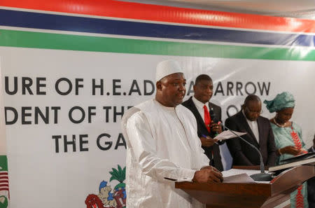 The swearing in ceremony at the inauguration of Gambia President Adama Barrow at the Gambian embassy in Dakar, Senegal January 19, 2017 is seen in this handout photo provided by Office of the Senegal Presidency. Picture taken January 19, 2017. REUTERS/Office of the Senegal Presidency/Handout