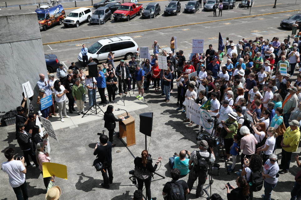 Demonstrators gather at the Oregon Capitol Building in support of the climate change bill HB2020 on Tuesday, June 25, 2019. (Noble Guyon/The Oregonian via AP)