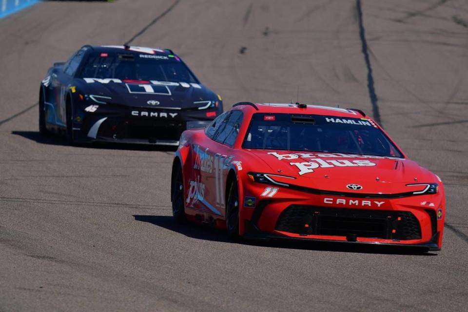 NASCAR Cup Series driver Denny Hamlin (11) leads driver Tyler Reddick (45) during the Shriners Children’s 500 on March 10, 2024, at Phoenix Raceway.