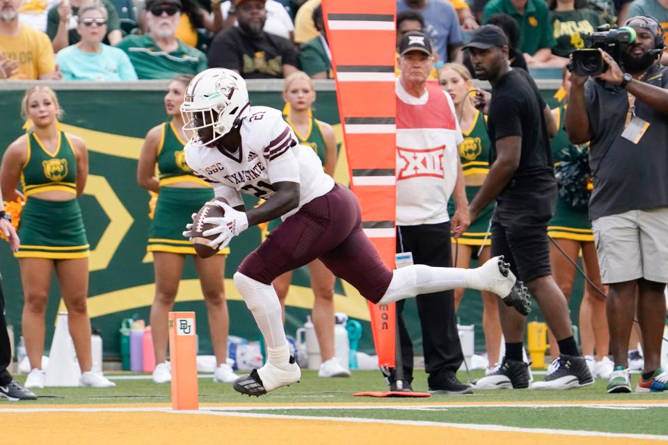 Texas State running back Ismail Mahdi scores the Bobcats' first touchdown of the season on a 10-yard pass from quarterback TJ Finley in the first quarter of the 42-31 win over Baylor last week. He scored Texas State's second touchdown of the season, too, on a 65-yard run later that quarter.