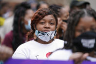 Tamika Palmer, the mother of Breonna Taylor, marches with Black Lives Matter protesters, Friday, Sept. 25, 2020, in Louisville. Breonna Taylor's family demanded Friday that Kentucky authorities release all body camera footage, police files and the transcripts of the grand jury hearings that led to no charges against police officers who killed the Black woman during a March drug raid at her apartment. (AP Photo/Darron Cummings)