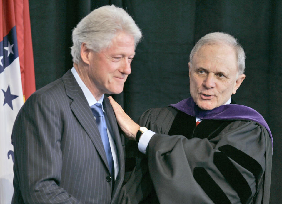 FILE - Former President Bill Clinton, left, is greeted by David Pryor, former senator and past dean of the University of Arkansas Clinton School of Public Service, Dec. 13, 2006, in Little Rock, Ark., after Clinton spoke to the first graduating class of the school. Former Arkansas governor and U.S. Sen. David Pryor, a Democrat who was one of the state’s most beloved political figures and remained active in public service in the state long after he left office, has died. He was 89. (AP Photo/Danny Johnston, File)
