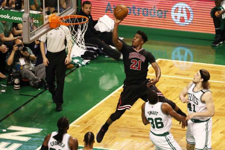 Jimmy Butler of the Chicago Bulls takes a shot against the Boston Celtics during the third quarter of Game One of the Eastern Conference quarter-finals, at TD Garden in Boston, Massachusetts, on April 16, 2017