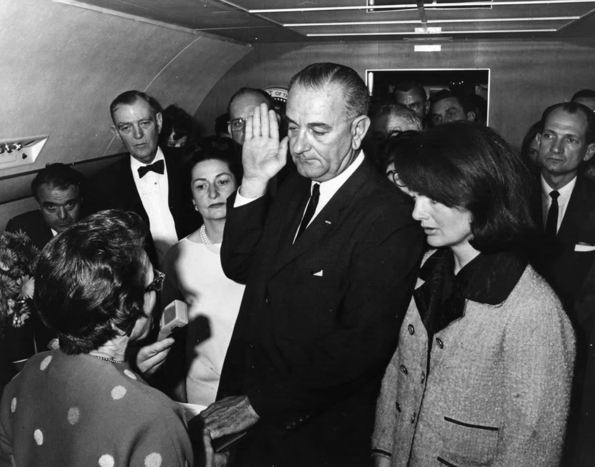 Kennedy’s vice president Lyndon Johnson is sworn in as the 36th President of the United States of America on board the presdential plane after Kennedy was pronounced dead (Getty Images)