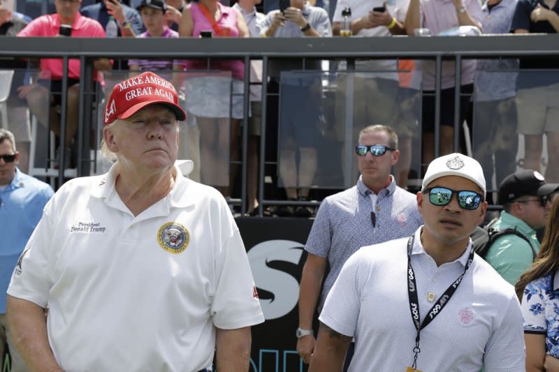 Former U.S. President Donald Trump (L), with personal valet and co-defendant in the federal documents case, Walt Nauta at the Aug. 2023 LIV Golf- Bedminster Tournament at Trump National Golf Club in Bedminster, N.J. Earlier this month, Judge Cannon postponed indefinitely Trump’s classified documents trial, making it less likely the case will go to trial before Election Day. File Photo by Peter Foley/UPI