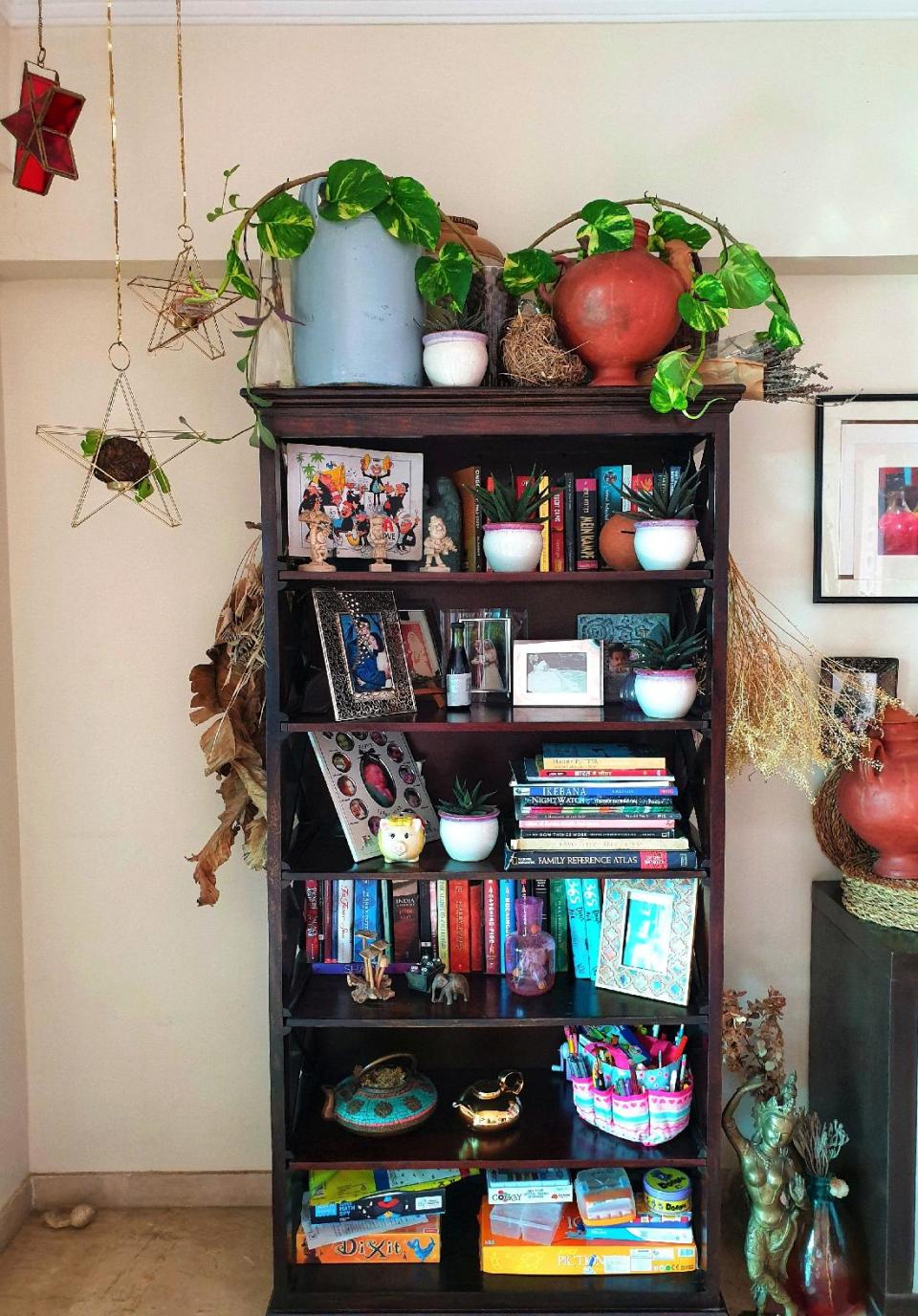 "My bookshelves are not just for books! I love collecting bits and bobs from all over. Old pickle jars and terracotta pots a personal favourite."