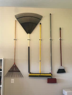 A pair of Command broom-holding wall mounts so those things can stop falling out of the closet