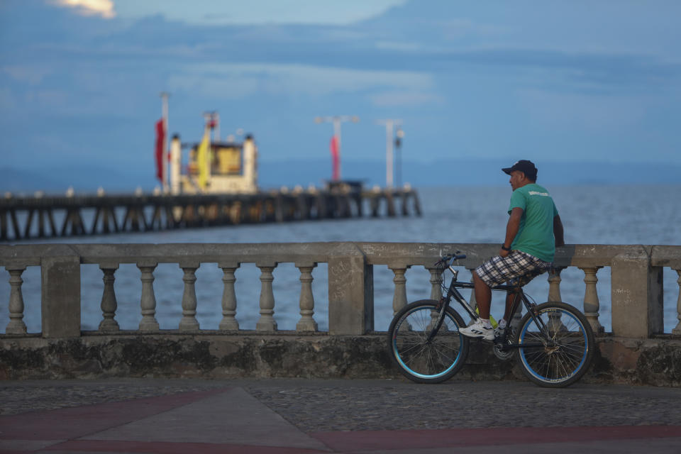 A man looks out into lake Nicaragua and sunset in the colonial city of Granada, Nicaragua, Monday, Sept. 10, 2018. Nicaragua’s economy has been devastated by the nearly five months of unrest sparked by cuts to social security benefits that quickly evolved into calls for President Daniel Ortega to step down. (AP Photo/Alfredo Zuniga)