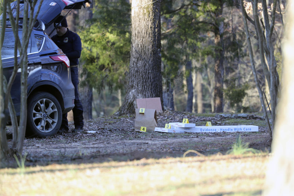 Law enforcement personnel investigate the scene of multiple shootings on Arkabutla Dam Road in Arkabutla, Miss on Friday, Feb. 17, 2023. Six people were fatally shot Friday at multiple locations in a small town in rural Mississippi near the Tennessee state line, and authorities blamed a lone suspect who was arrested and charged with murder. (AP Photo/Nikki Boertman)