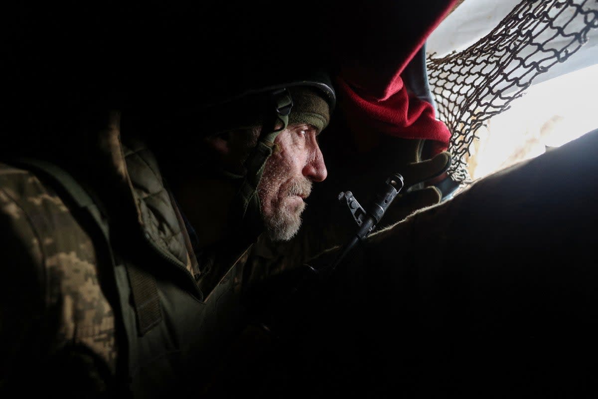 A Ukrainian soldier holds his position at the front line near a Russian-occupied Ukrainian city in the Donetsk region (Getty)