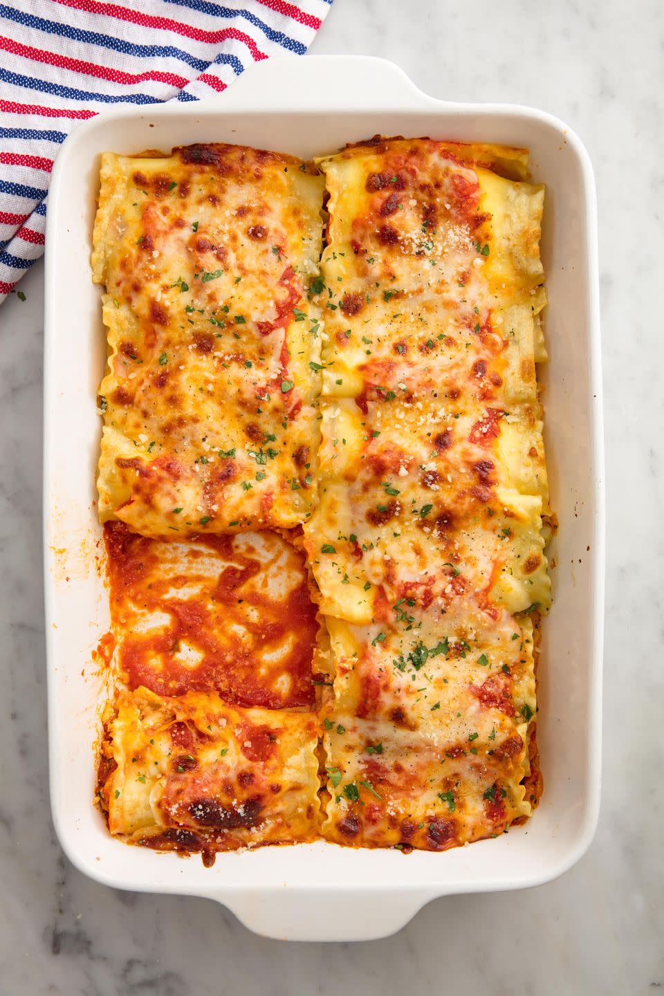 <p><a href="https://www.delish.com/cooking/recipe-ideas/recipes/a51337/classic-lasagna-recipe/" rel="nofollow noopener" target="_blank" data-ylk="slk:Classic lasagna" class="link ">Classic lasagna</a>, as much as we adore it, can be extremely time-consuming. These roll-ups come together in no time and couldn't be more delicious. This spinach and ricotta version (but feel free to add meat if you like!) is quick and simple and still every bit as comforting as the traditional.</p><p>Get the <strong><a href="https://www.delish.com/cooking/recipe-ideas/recipes/a57970/best-lasagna-roll-ups-recipe/" rel="nofollow noopener" target="_blank" data-ylk="slk:Lasagna Roll-Ups recipe" class="link ">Lasagna Roll-Ups recipe</a>.</strong></p>