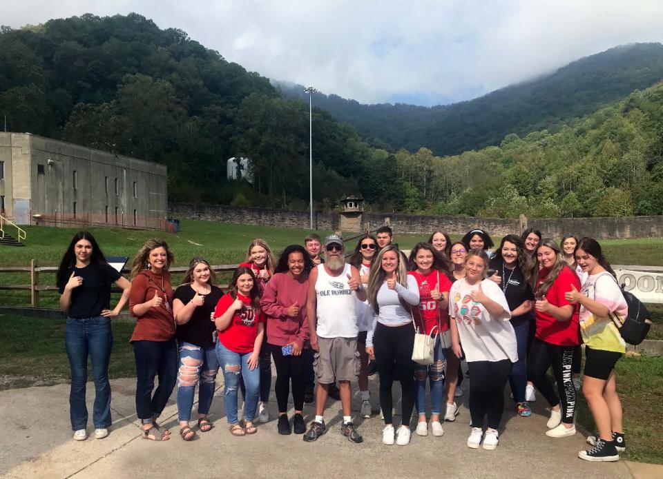 Students in Scott High School educator Lacey Massengale's dual enrollment class offered by Roane State are pictured at the former Brushy Mountain Penitentiary with their tour guide, a former inmate named George.