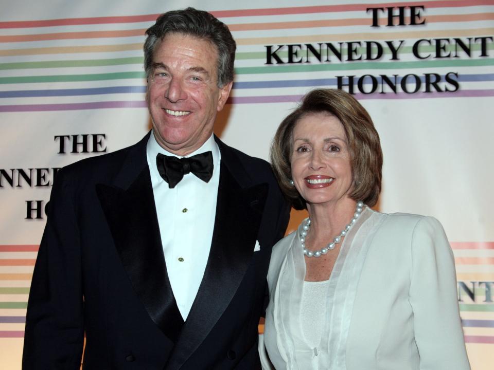 Nancy Pelosi (D-CA) (R) and her husband Paul Pelosi arrive at the 30th Annual Kennedy Center Honors December 2, 2007 in Washington, DC