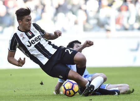 Football Soccer - Juventus v Lazio - Italian Serie A - Juventus stadium, Turin, Italy - 22/01/17 - Juventus' Paulo Dybala in action with Lazio's Marco Parolo . REUTERS/Giorgio Perottino