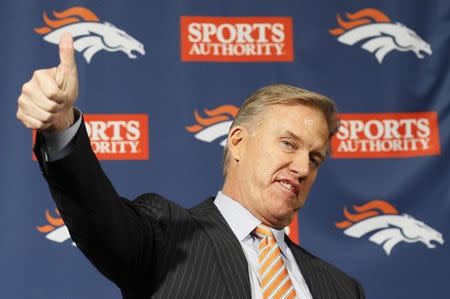 Denver Broncos vice-president John Elway explains his reaction to receiving the call from new quarterback Peyton Manning informing him of his decision to sign with the Broncos in Englewood, Colorado March 20, 2012. REUTERS/Rick Wilking