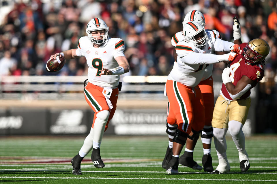 Nov. 24, 2023; Chestnut Hill, Massachusetts; Miami Hurricanes quarterback Tyler Van Dyke (9) looks to pass against the Boston College Eagles during the first half at Alumni Stadium. Brian Fluharty-USA TODAY Sports