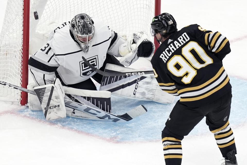 Boston Bruins' Anthony Richard (90) scores on Los Angeles Kings' David Rittich (31) during the second period of an NHL hockey game, Saturday, Feb. 17, 2024, in Boston. (AP Photo/Michael Dwyer)