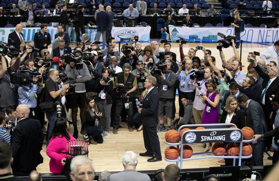 ACC Commissioner John Swafford waits for the players from Florida State and Clemson to join him on the court of the Greensboro Coliseum, before announcing the cancellation the ACC Men’s Basketball Tournament due to the COVID-19 virus on Thursday, March 12, 2020 at the Greensboro Coliseum in Greensboro, N.C.