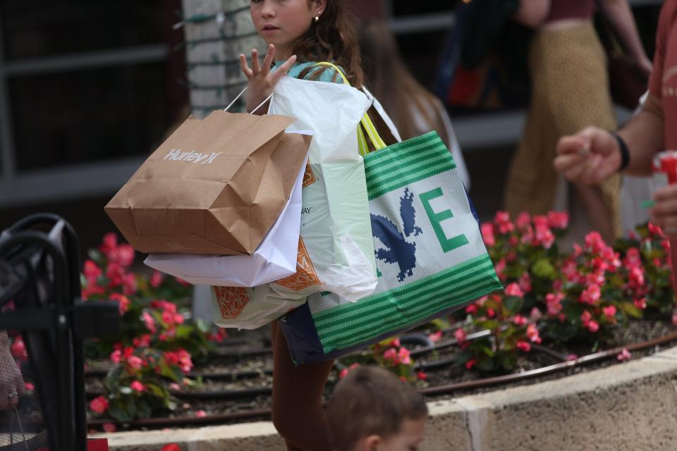 Shoppers looking for deals pack Miramar Outlets in Estero on Black Friday on Friday, Nov. 24, 2023.