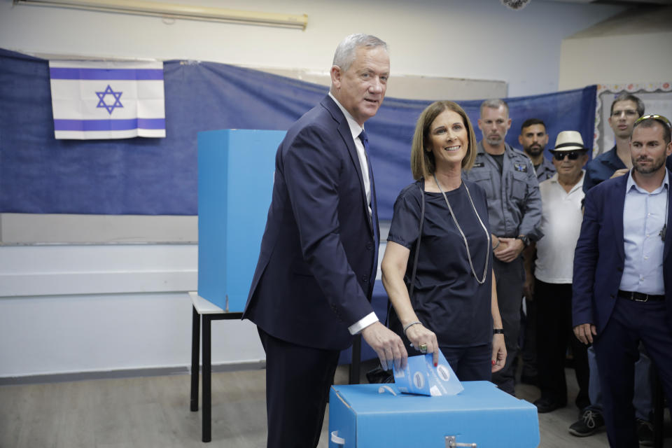 Blue and White party leader Benny Gantz and his wife Revital vote in Rosh Haayin, Israel, Tuesday, Sept. 17, 2019. Israelis began voting Tuesday in an unprecedented repeat election that will decide whether longtime Prime Minister Benjamin Netanyahu stays in power despite a looming indictment on corruption charges. (AP Photo/Sebastian Scheiner)