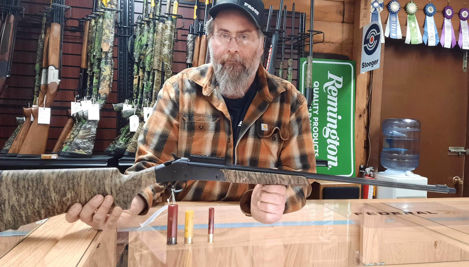 Chris Cogan, gun shop manager at Juniata Trading Co., holds a .410 single shot shotgun that has become popular with spring turkey hunters. In front of the gun, from left, are a 12-gauge, 20-gauge, and .410 shells.  Relatively new TSS shot shell technology has made .410 loads to be effective for large gobblers.