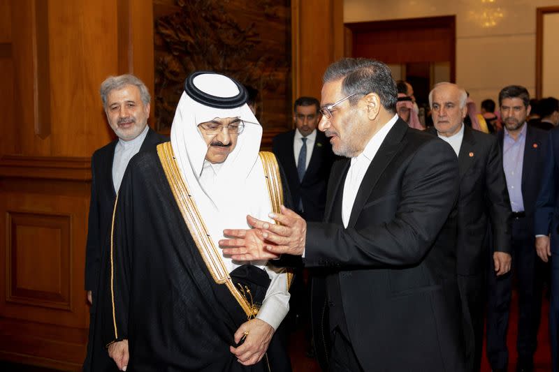 Secretary of Iran's Supreme National Security Council Ali Shamkhani talks with Minister of State and national security adviser of Saudi Arabia Musaad bin Mohammed Al Aiban during a meeting in Beijing