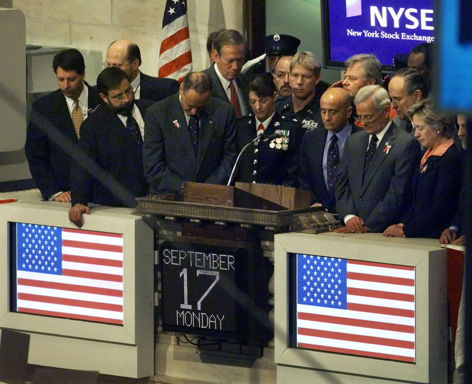 Dignataries bow their heads during a moment of silence in honor of the
victims of the World Trade Tower disaster, on the floor of the New York
Stock Exchange in New York September 17, 2001. This is the first day of
trading since two hijacked jetliners crashed into the twin towers of
the World Trade Center on September 11. REUTERS/Jeff Christensen

JC/SV