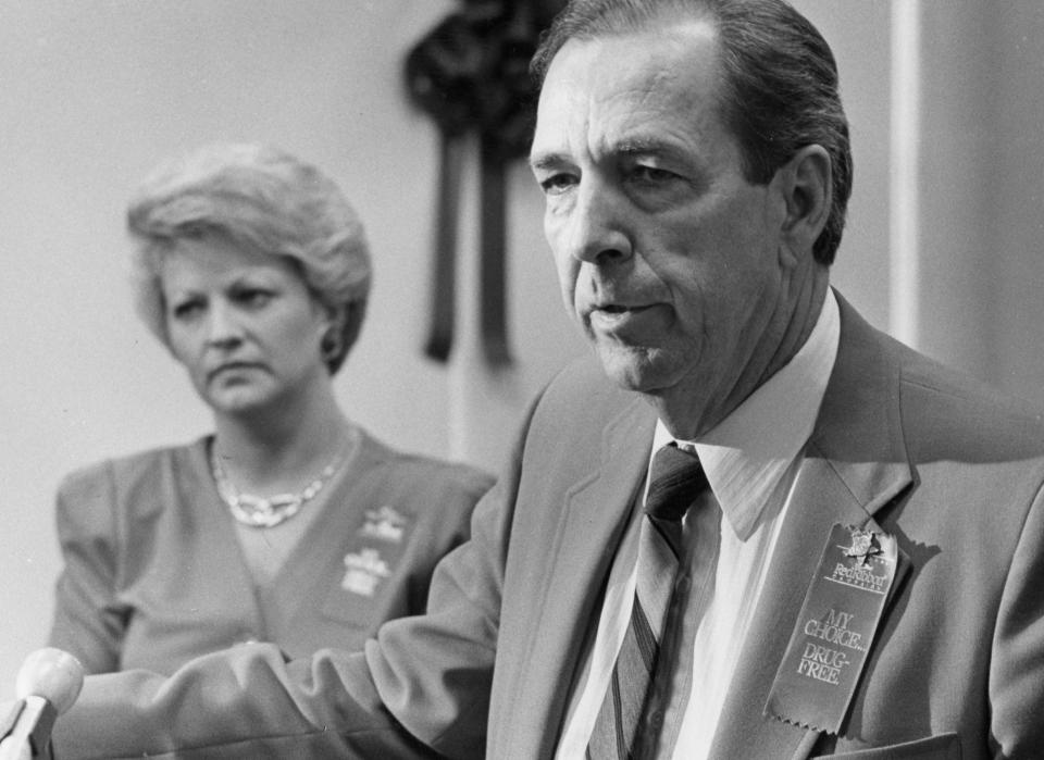 Roger Morris Bedsole speaks at an anti-drug event in 1989 as his wife Donna looks on.