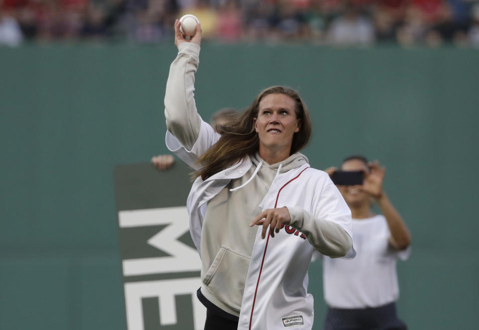 Alyssa Naeher, goalkeeper for the U.S. women's soccer team, throws a ceremonial first pitch before a baseball game between the Boston Red Sox and the Los Angeles Dodgers at Fenway Park, Friday, July 12, 2019, in Boston. (AP Photo/Elise Amendola)