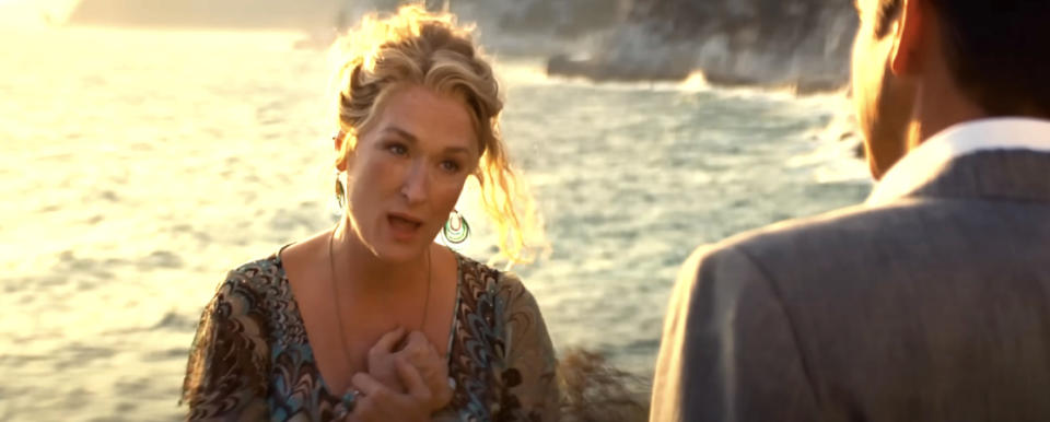 Meryl Streep and Pierce Brosnan in a heartfelt conversation by the seaside in a scene from "Mamma Mia!"