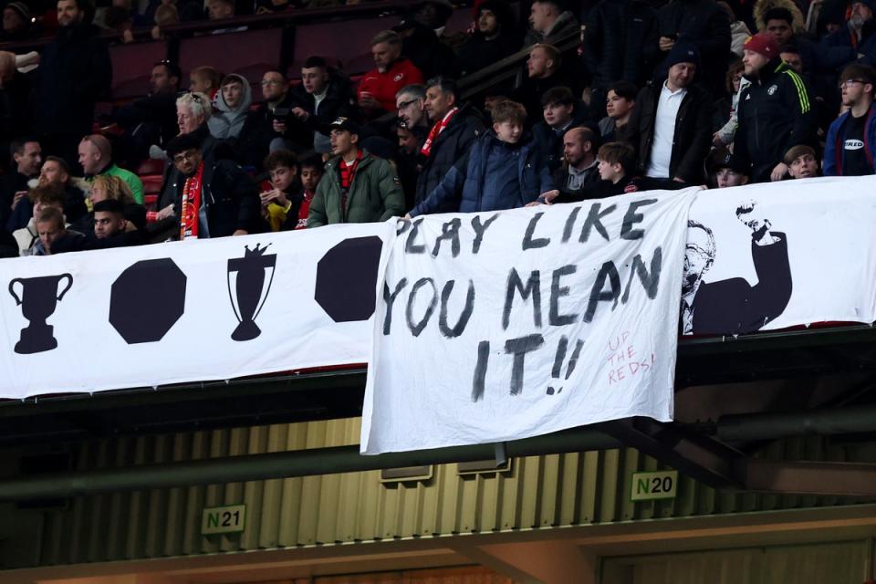 A banner at Old Trafford tells United to ‘play like you mean it’ (Getty Images)