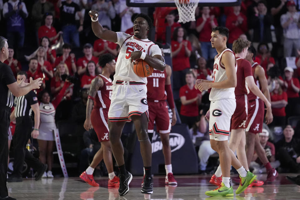 Georgia center Russel Tchewa (54) reacts after a basket in the first half of an NCAA college basketball game against Alabama Wednesday, Jan. 31, 2024, in Athens, Ga. (AP Photo/John Bazemore)