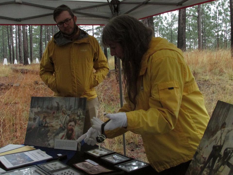 During a March 10, 2023, guided tour, Linda Carnes-McNaughton, curator of Fort Bragg's Cultural Resources Management Program, shows artifiacts that were excavated near the Monroe's Crossroads battlefield site, which is on present-day Fort Bragg.