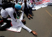 Kenyan doctors perform a drill during a strike to demand fulfilment of a 2013 agreement between their union and the government that would raise their pay and improve working conditions in Nairobi, Kenya December 5, 2016. REUTERS/Thomas Mukoya