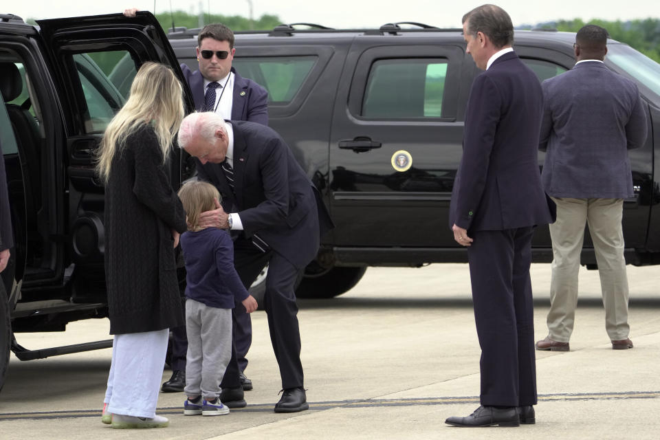 President Joe Biden greets his grandson Beau Biden as Hunter Biden and wife Melissa Cohen Biden watch, at Delaware Air National Guard Base in New Castle, Del., Tuesday, June 11, 2024. (AP Photo/Manuel Balce Ceneta)