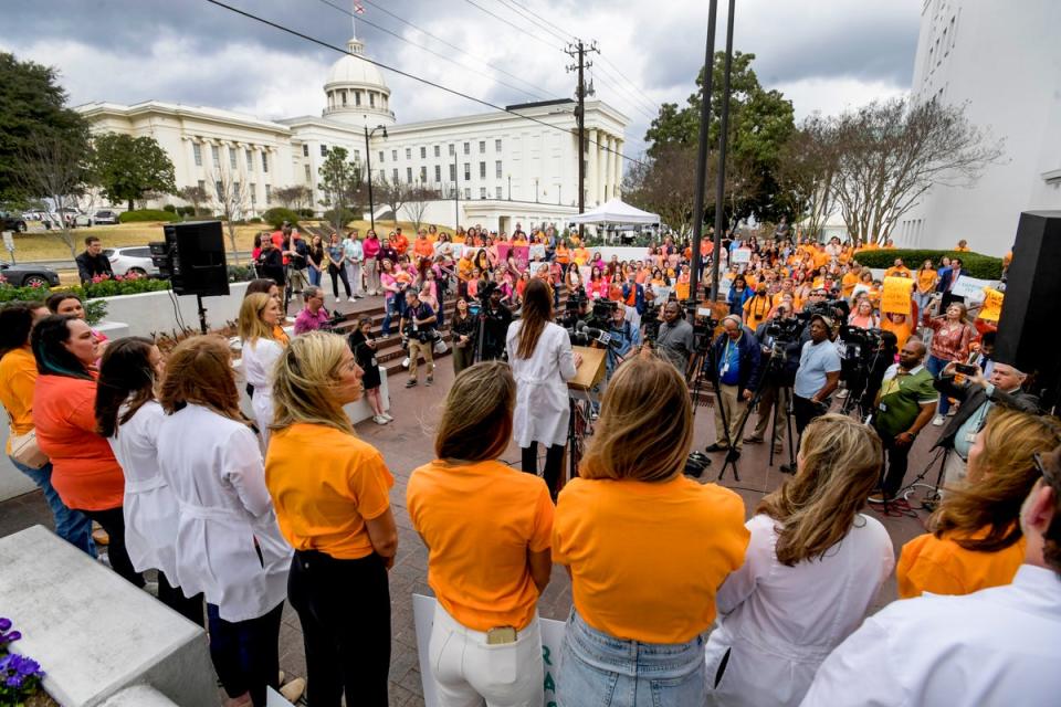 Hundreds of women rally outside the Alabama State House on Wednesday in support of legislation to protect IVF treatment (AP)
