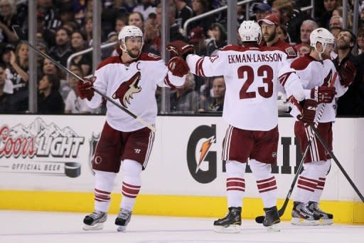 Shane Doan (L) and Oliver Ekman-Larsson of the Phoenix Coyotes celebrate Doan's second period goal during the 2012 NHL Stanley Cup Playoffs at Staples Center in Los Angeles, California. Doan scored twice and Mike Smith posted this third shutout of the post-season as the Phoenix Coyotes staved off elimination from the Stanley Cup playoffs by beating Los Angeles 2-0