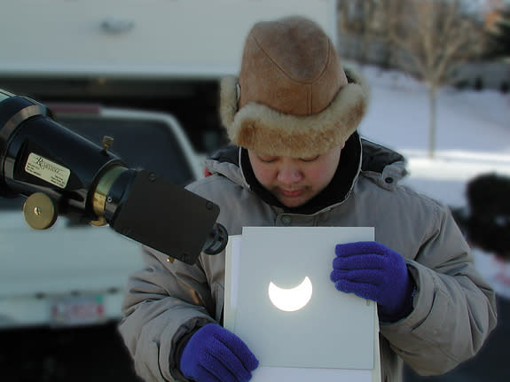 The safest and simplest technique to observe and photograph the eclipse is to use your telescope (or one side of your binoculars) to project a magnified image of the sun’s disk onto a shaded white piece of cardboard. This view was taken near B