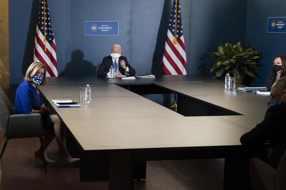 President-elect Joe Biden, speaks during a meeting with Vice President-elect Kamala Harris, right, Senate Minority Leader Chuck Schumer of N.Y., and House Speaker Nancy Pelosi of Calif., left, Friday, Nov. 20, 2020, in Wilmington, Del. (AP Photo/Alex Brandon)