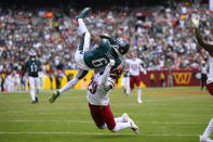 Philadelphia Eagles wide receiver DeVonta Smith (6) makes a catch against Washington Commanders cornerback Kendall Fuller (29) during the first half of an NFL football game, Sunday, Sept. 25, 2022, in Landover, Md. (AP Photo/Nick Wass)