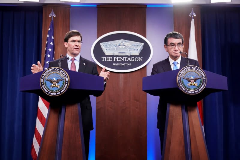 U.S. Secretary of Defense Mark Esper speaks as Japan’s Defense Minister Taro Kono looks on during a joint news conference at the Pentagon in Washington