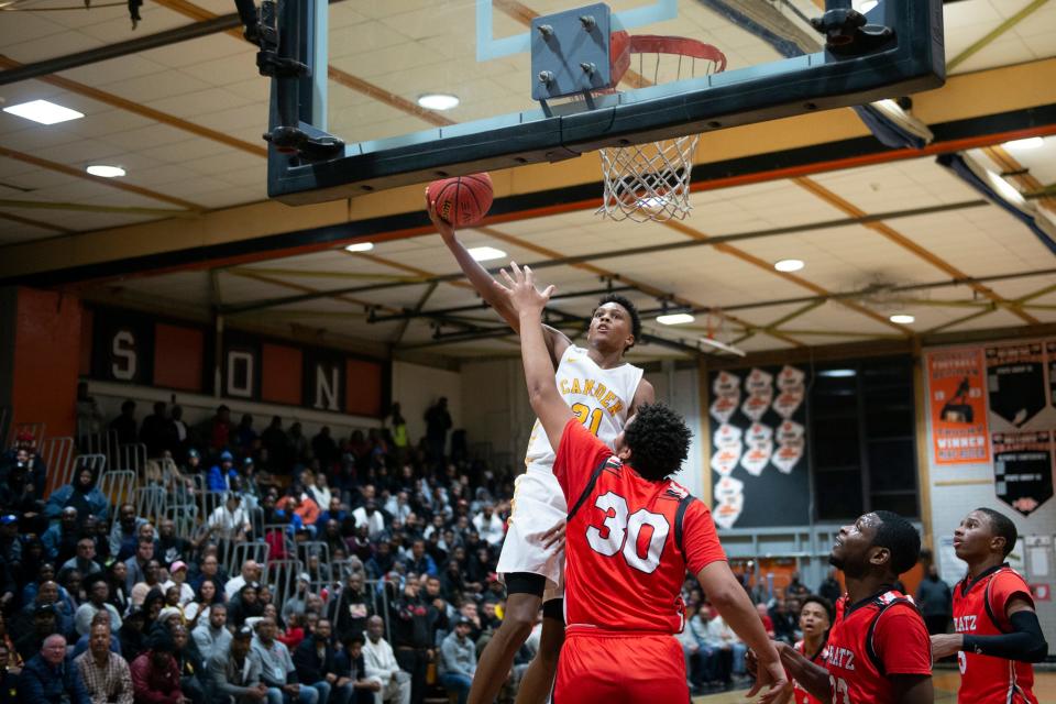 Camden's DJ Wagner (21) goes for the basket against Simon Gratz in Camden, N.J. Friday, Dec. 20, 2019. Camden won 72-52.