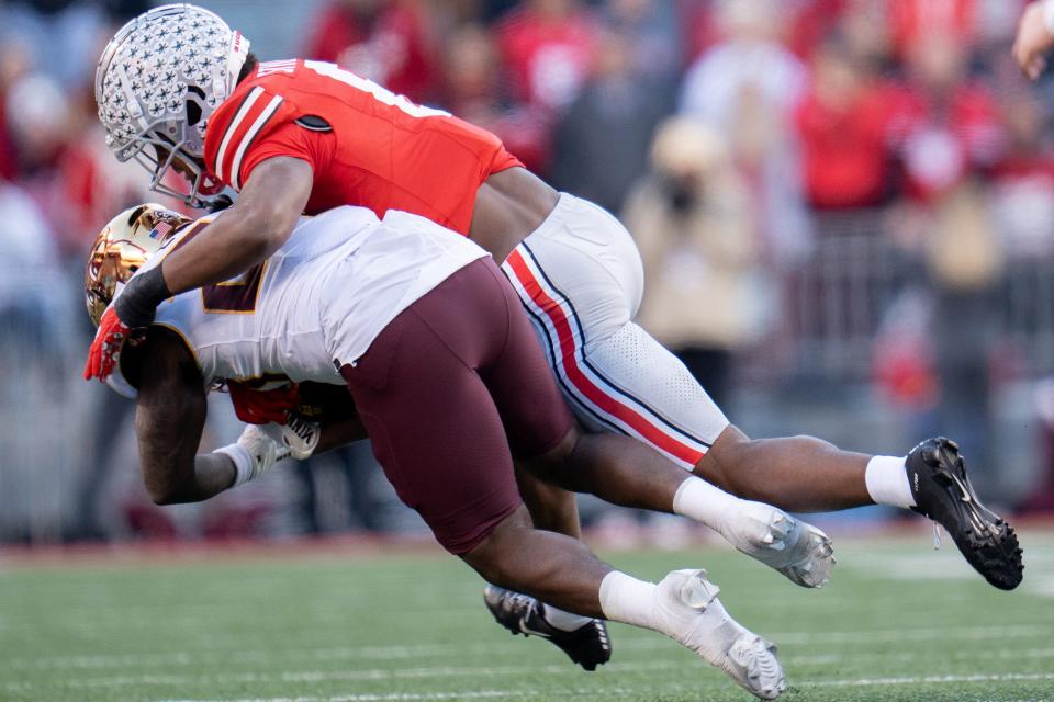 Nov 18, 2023; Columbus, Ohio, USA; 
Ohio State Buckeyes safety Sonny Styles (6) tackles Minnesota Golden Gophers running back Zach Evans (26) during the first half of their game on Saturday, Nov. 18, 2023 at Ohio Stadium.