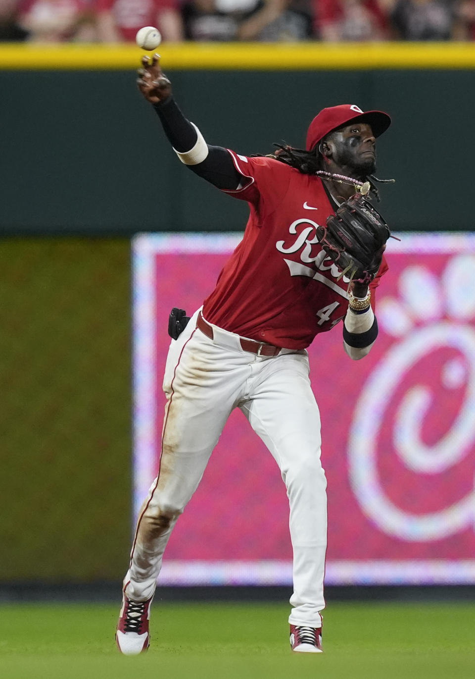 Cincinnati Reds shortstop Elly De La Cruz (44) fields a ball hit by Baltimore Orioles' Jorge Mateo and throws to first for the out in the ninth inning of a baseball game on Saturday, May 4, 2024, in Cincinnati. (AP Photo/Carolyn Kaster)