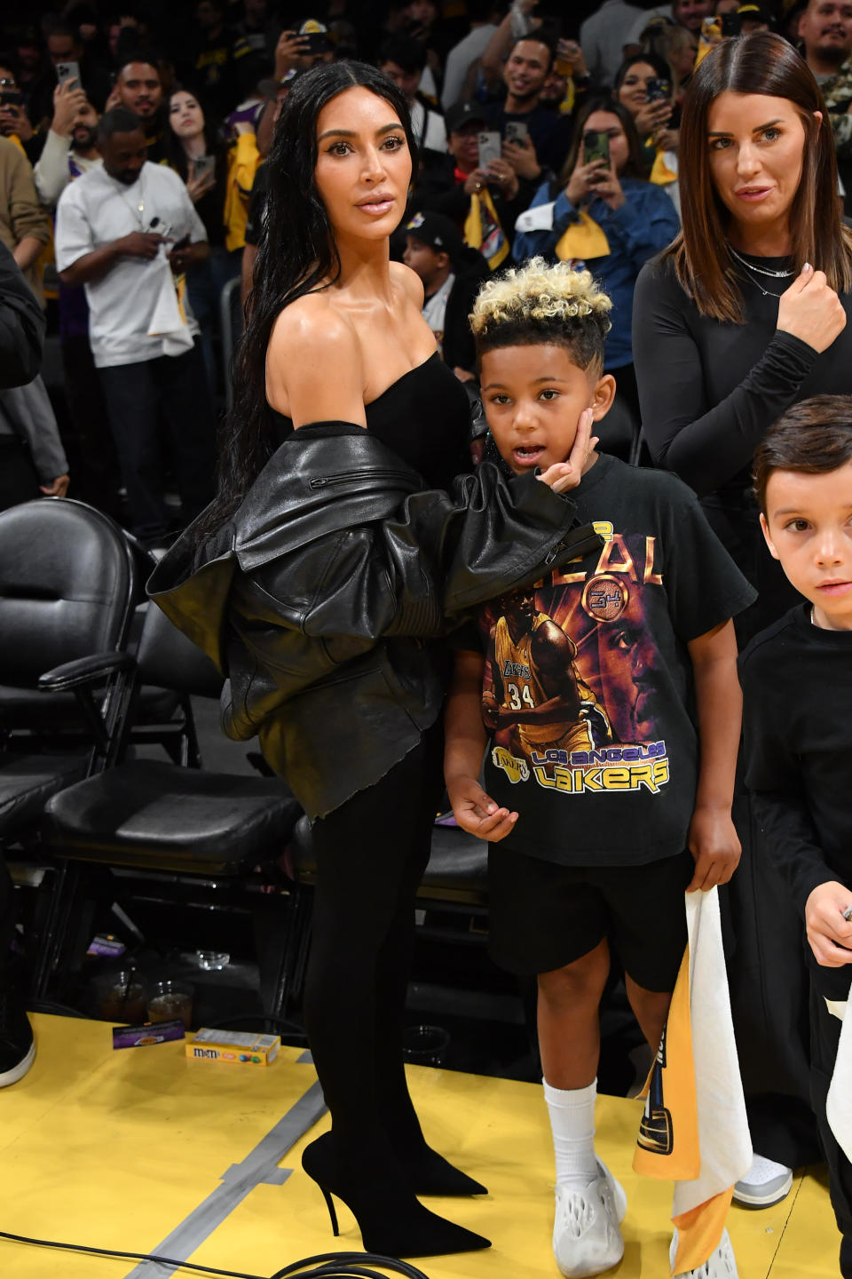 LOS ANGELES, CALIFORNIA - DECEMBER 05: Kim Kardashian and Saint West attend a basketball game between the Los Angeles Lakers and the Phoenix Suns at Crypto.com Arena on December 05, 2023 in Los Angeles, California. NOTE TO USER: User expressly acknowledges and agrees that, by downloading and or using this photograph, User is consenting to the terms and conditions of the Getty Images License Agreement. (Photo by Allen Berezovsky/Getty Images)