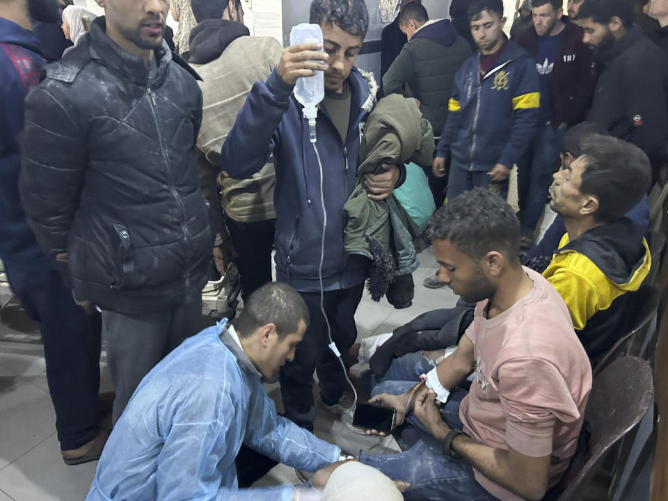 Palestinians wounded in an Israeli strike while waiting for humanitarian aid on the beach in Gaza City are treated in Shifa Hospital on Thursday, Feb. 29, 2024. (AP Photo/Mahmoud Essa)